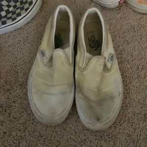 3 slip on vans (blurry, white, and yellow/blue/red checkered)